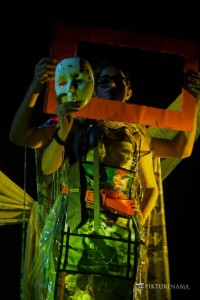 Ishita looks at her mask as a part of Fine Art photography workshop kolkata by Agnimirh Basu