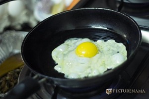 eggs getting fried while preparation of All Day breakfast of Flurys Kolkata at home
