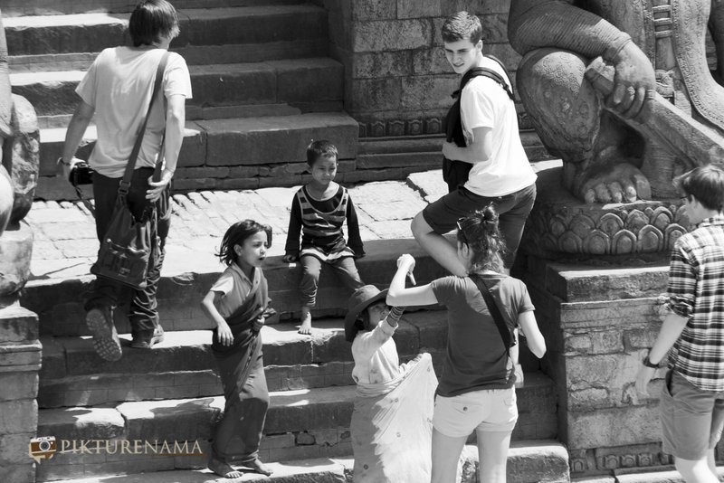 Kids with tourists at Bhaktapur Durbaraquare Nepal