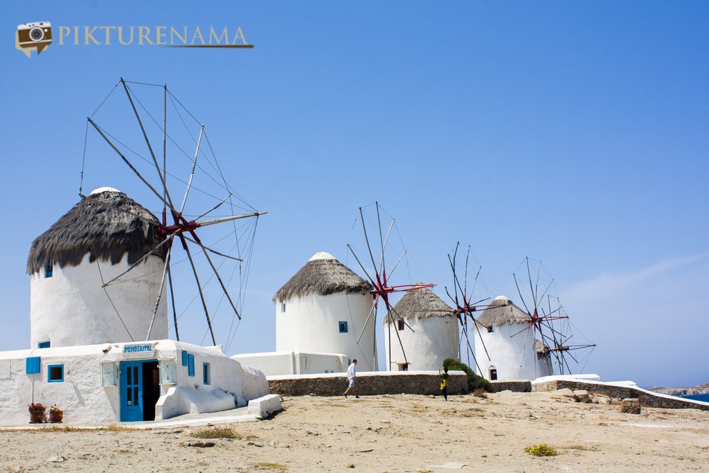 Kato Myloi - The windmills of Mykonos Greece by pikturenama onlooking into the sea 