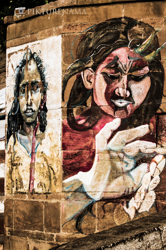 Graffiti on Varanasi Ghats faces on the wall