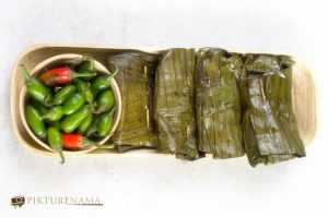 Ilish Paturi and some green chillies